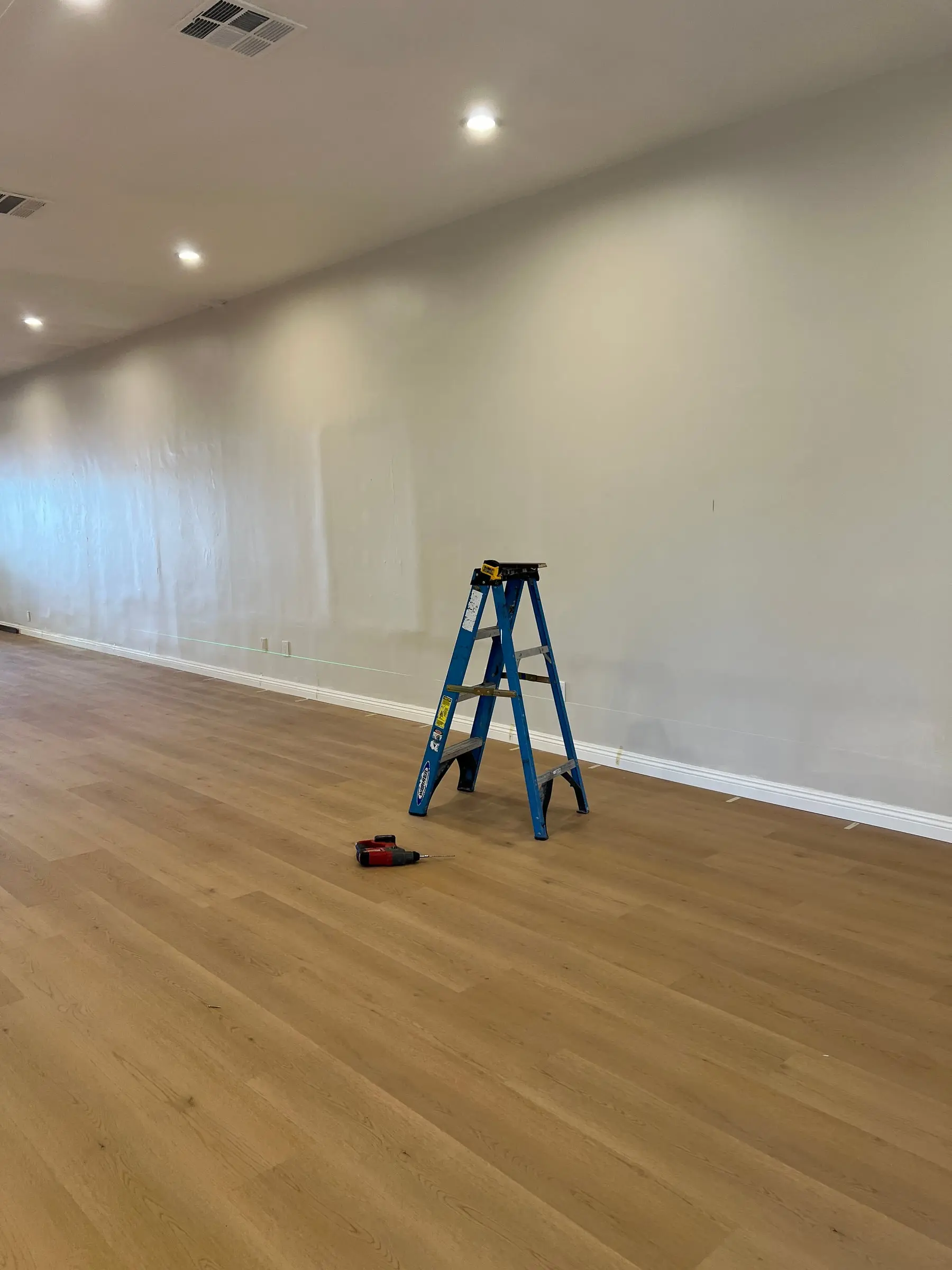 Studio wall prepped for a mirror wall installation